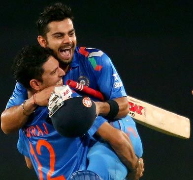 Virat Kohli is hugged by Yuvraj Singh after hitting the winning runs against South Africa in the ICC World Twenty20 semi-final.