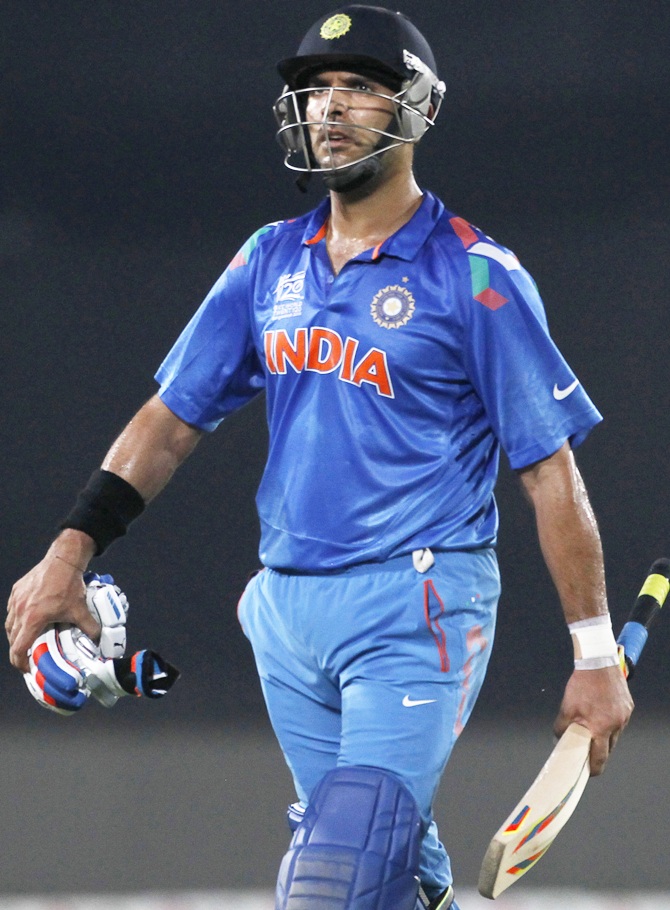 India's Yuvraj Singh leaves the field after being dismissed