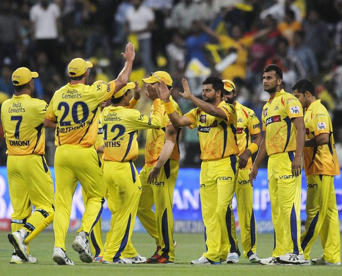 Chennai Super Kings players celebrate the fall of a Delhi wicket