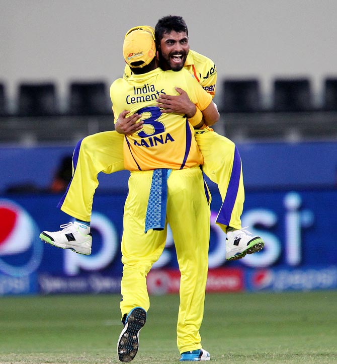 Ravindra Jadeja celebrates with Suresh Raina after taking the wicket of Steven Smith