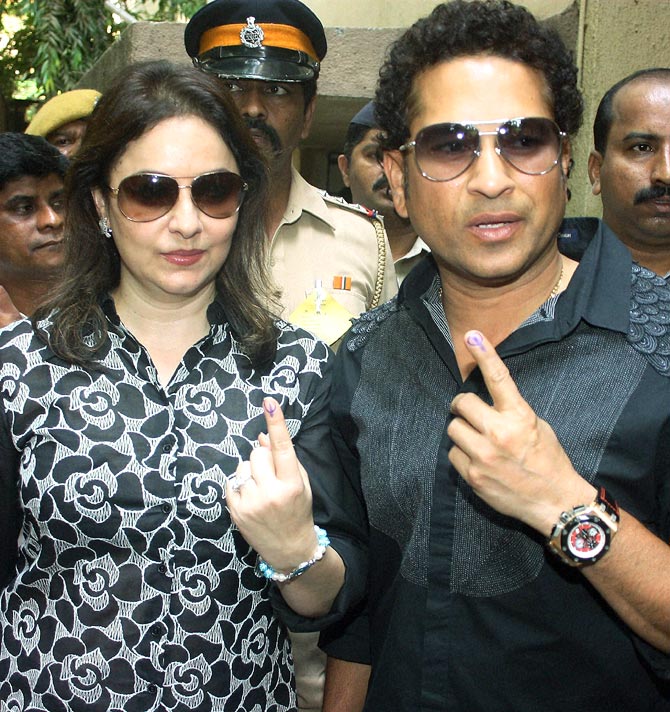 Sachin Tendulkar and his wife Anjali after casting their votes in Mumbai on Thursday.