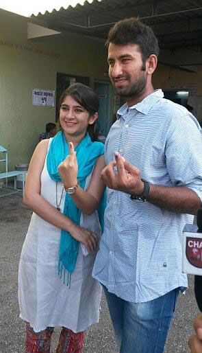 Cheteshwar Pujara and his wife after casting their vote