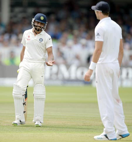 Ravindra Jadeja of India speaks with James Anderson of England during day four of   second Test at Lord's Cricket Ground on July 20, 2014