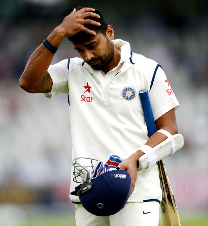 Murali Vijay of India leaves the field after being dismissed by James Anderson