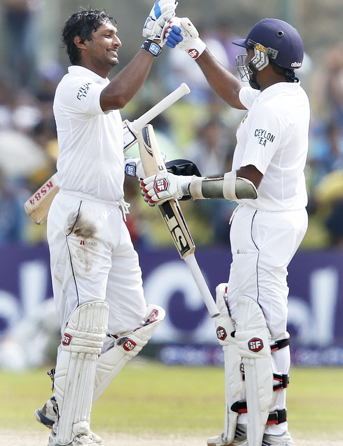 Sri Lanka's Kumar Sangakkara, left, celebrates his century with teammate Mahela Jayawardene