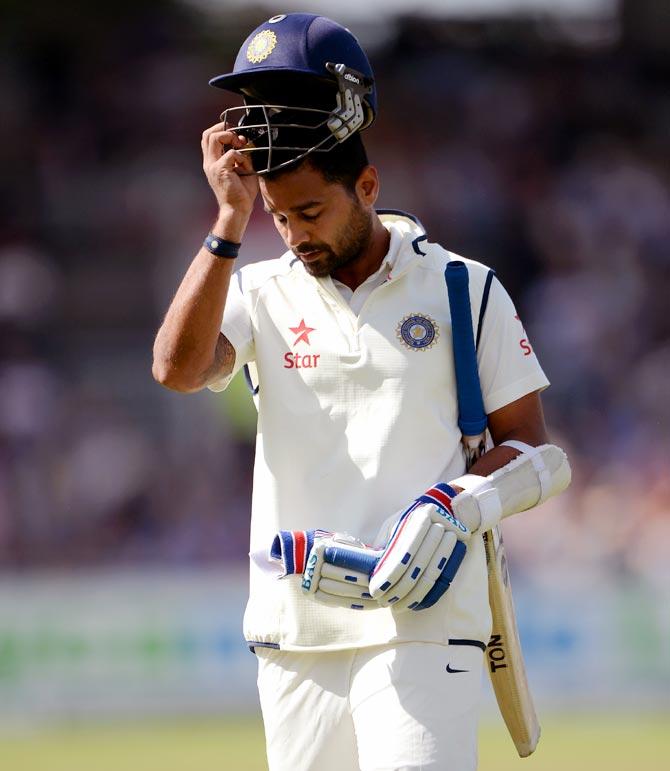 Murali Vijay of India walks back after his dismissal