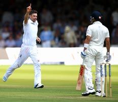 James Anderson (left) celebrates after taking the wicket of Virat Kohli.