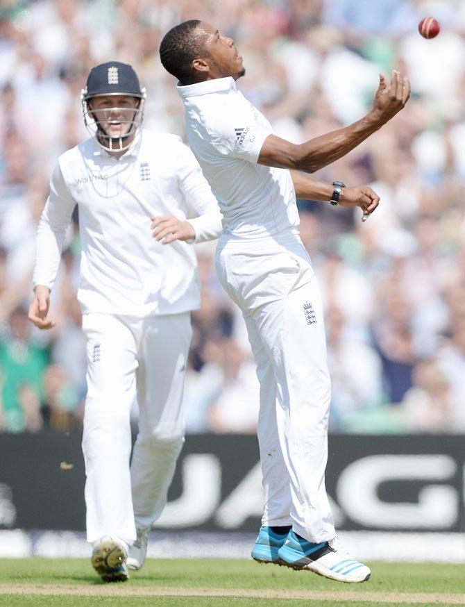 Chris Jordan of England celebrates catching out Ajinkya Rahane