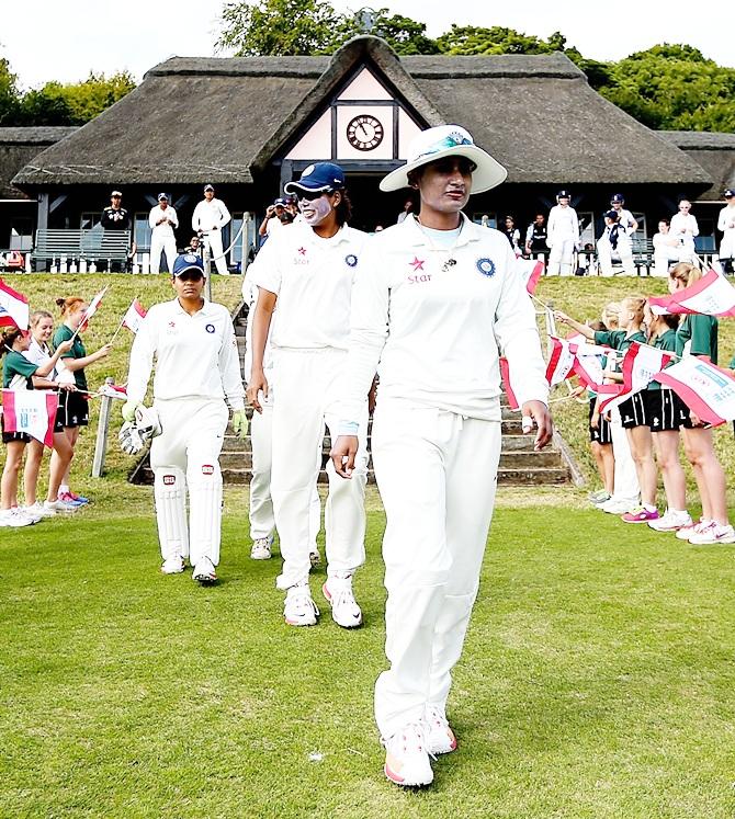 Mithali Raj of India leads her team into the field