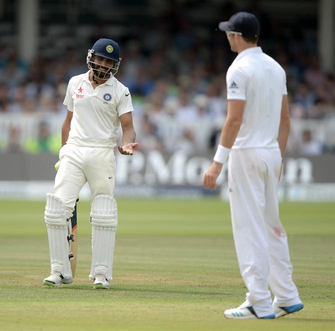 Ravindra Jadeja (left) speaks with James Anderson during the second Test at Lord's in London