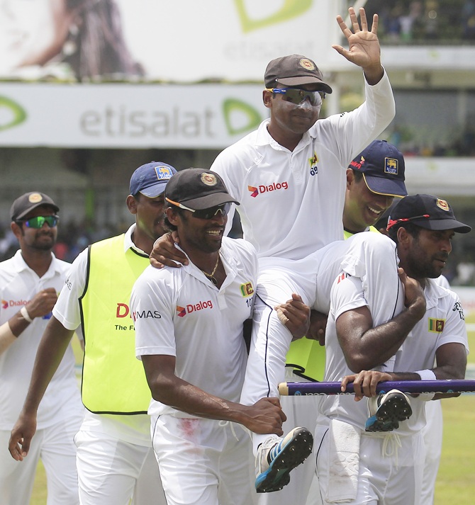 Sri Lanka's Mahela Jayawardene is carried by his teammates after winning their final Test match against Pakistan in Colombo