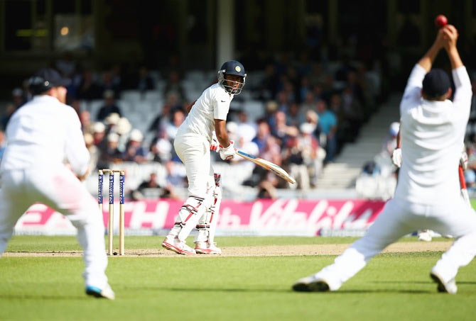 Ravichandran Ashwin of India looks back as Gary Ballance of England parries the ball before Ian Bell catches him out for 7 runs of the bowling of Chris Jordan