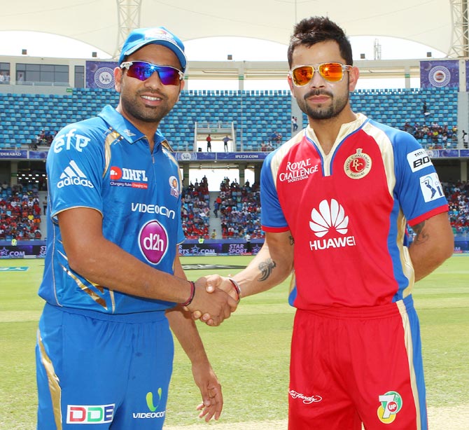 Mumbai Indians captain Rohit Sharma (left) with Royal Challengers Bangalore captain Virat Kohli during the Indian Premier League