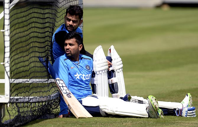 Virat Kohli (left) and Murali Vijay relax during a nets session