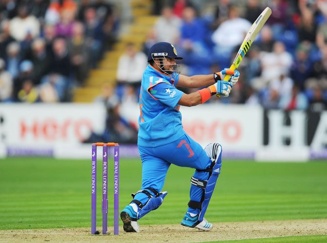 Suresh Raina hit a century (off 75 balls) to ensure India won the ODI against England in Cardiff, August 27, 2014. Photograph: Stu Forster/Getty Images