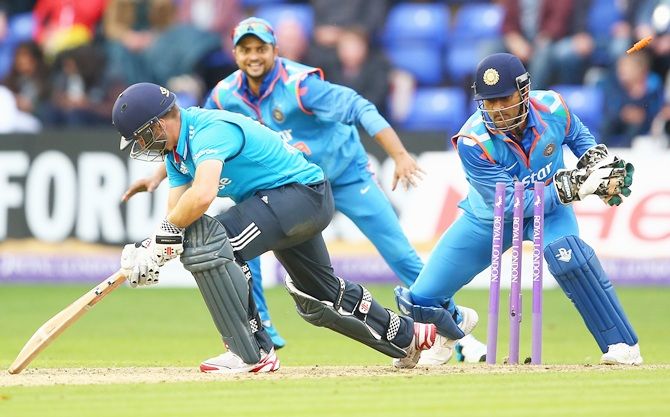 Chris Woakes of England is stumped by MS Dhoni of India 