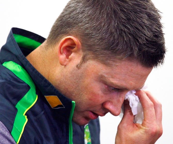 Australian cricket captain Michael Clarke wipes his eyes as he breaks down during a press conference