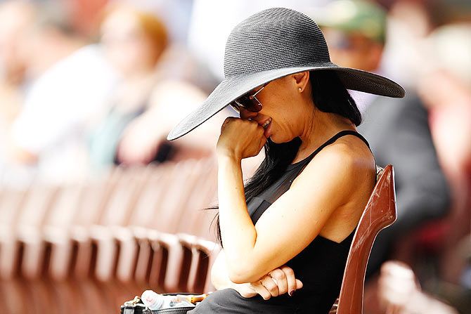 A woman reacts during the funeral service for Phillip Hughes