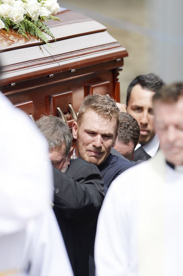 Aaron Finch shows his emotions as he carries Phillip Hughes's casket