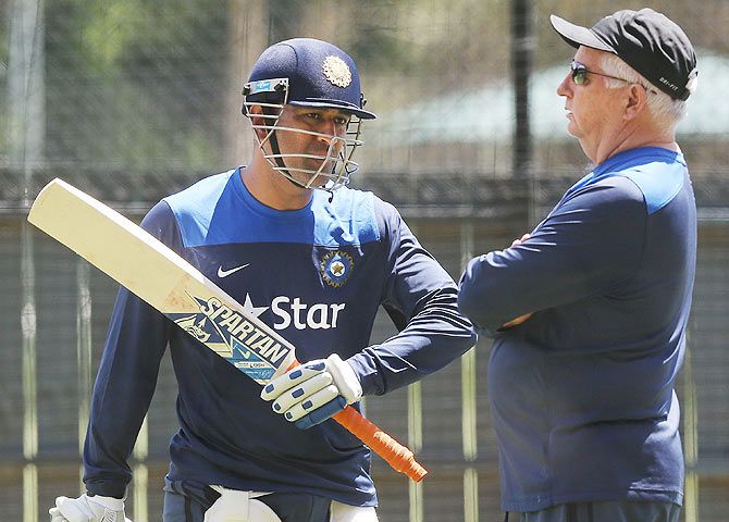 Mahendra Singh Dhoni talks to coach Duncan Fletcher during a training session at Adelaide Oval on Monday