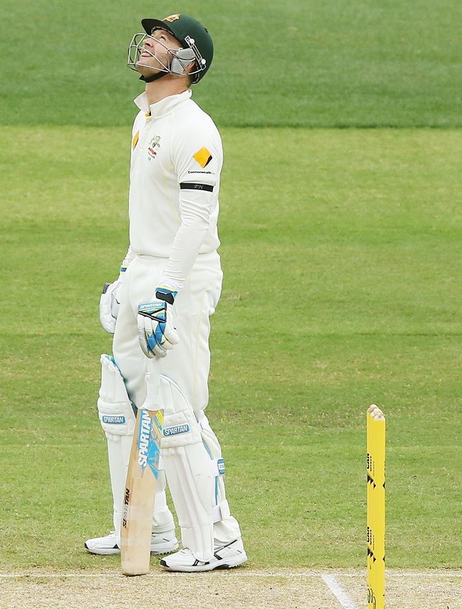 Michael Clarke of Australia looks up to the sky after hitting the 408th run in their first   innings, the same number of the late Phillip Hughes who was the 408th Test player for Australia