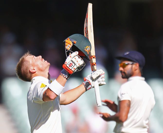 David Warner of Australia celebrates his century on Day 4 of the first Test at the Adelaide Oval on Friday