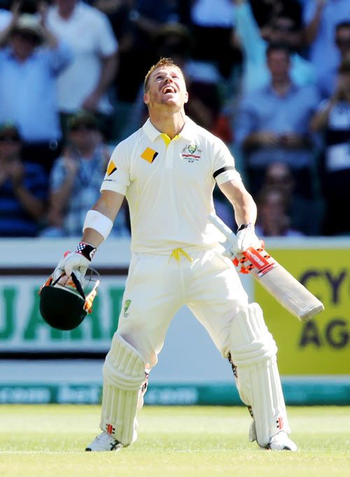 David Warner of Australia celebrates his century on Day 4 of the first Test at the Adelaide Oval on Friday
