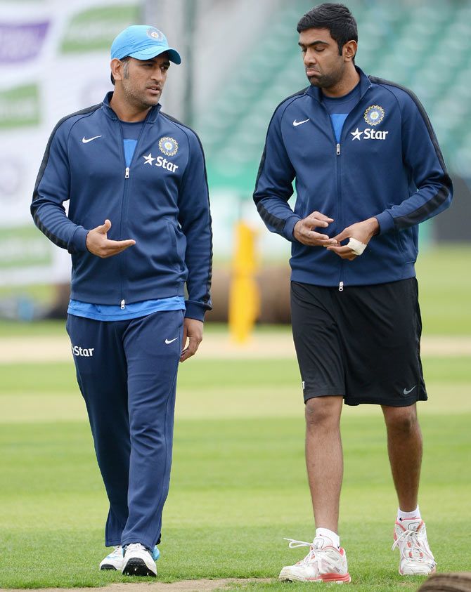 Mahendra Singh Dhoni of India speaks with R Ashwin 