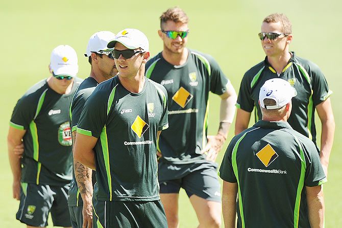 Josh Hazlewood looks on with teammates during an Australian training session at The Gabba in Brisbane on Tuesday