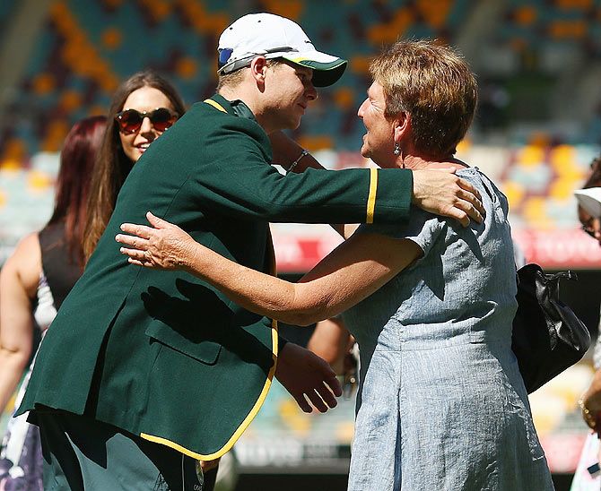 Newly appointed Australian captain Steve Smith embraces his mother after receiving his Captain's jacket 