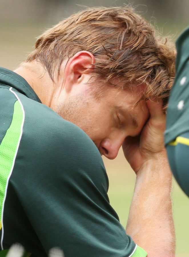 Shane Watson of Australia puts his hand on his head after being hit in the helmet whilst batting in the nets at Melbourne Cricket Ground on Tuesday