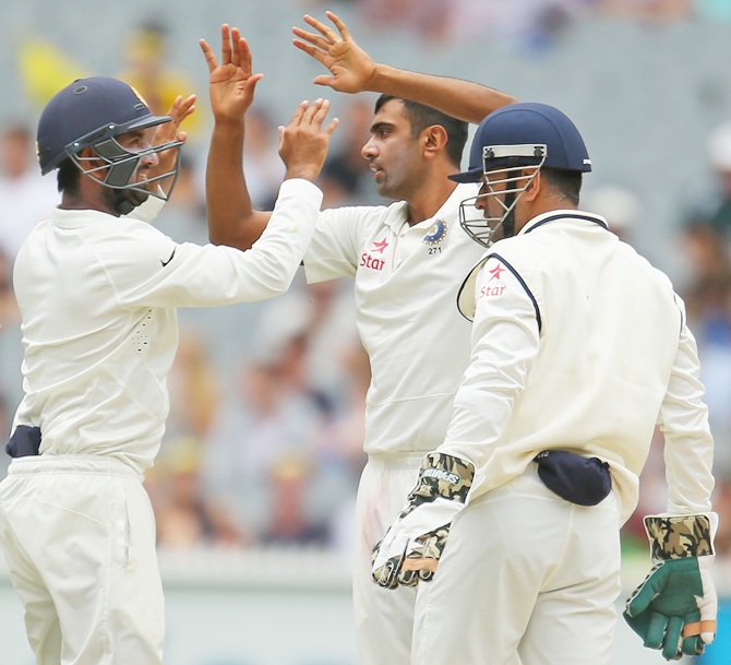 Ravichandran Ashwin of India celebrates after dismissing David Warner of Australia