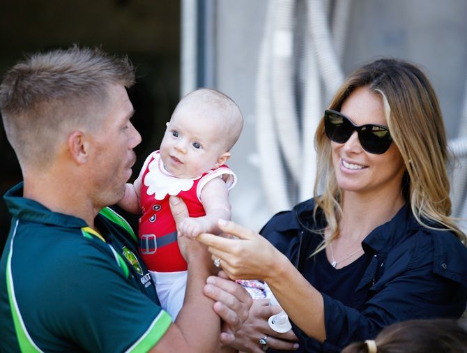 David Warner and partner Candice Falzon with their daughter Ivy are seen during an Australian nets session at Melbourne Cricket Ground