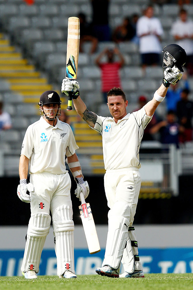 Brendon McCullum of New Zealand celebrates his century in Auckland on Thursday
