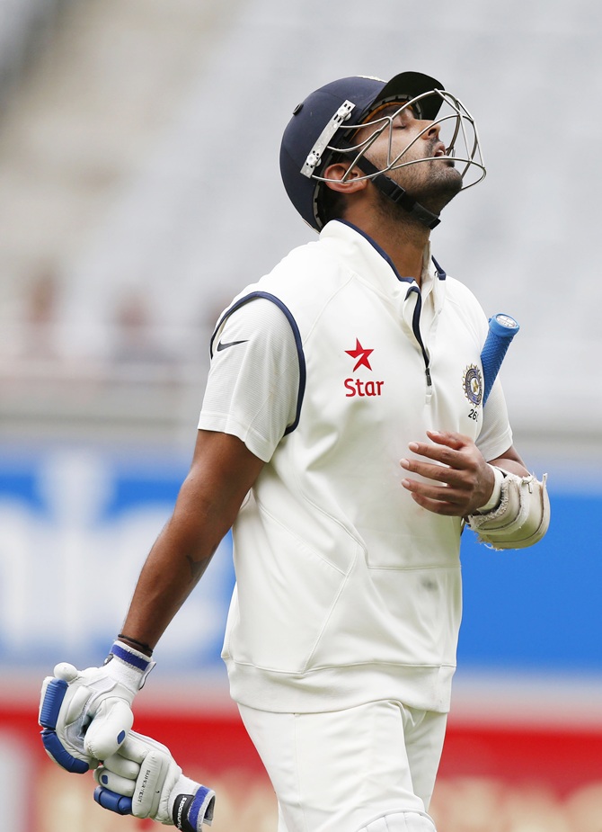 India's Murali Vijay reacts after being bowled out