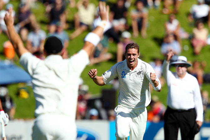Tim Southee celebrates after taking the wicket of Murali Vijay