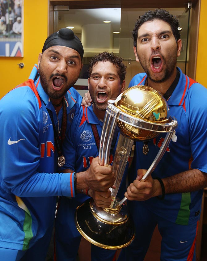 Left to right: Harbhajan Singh, Sachin Tendulkar and Yuvraj Singh celebrate after winning the 2011 World Cup in Mumbai