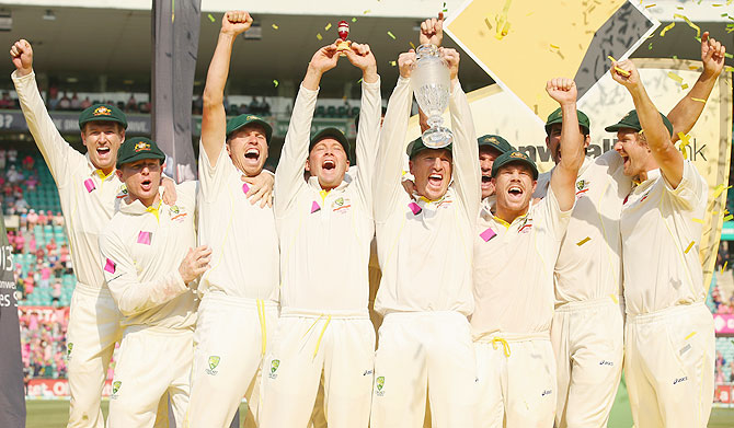 The Australian team celebrate with the after winning the fifth Ashes Test and the series 5 - 0 on day three at Sydney Cricket Ground in Sydney on Sunday