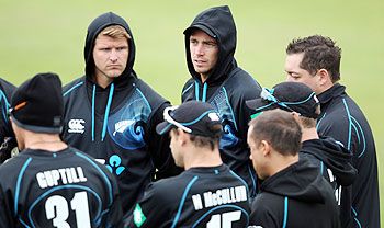 Tim Southee of New Zealand listens intently during a team meeting