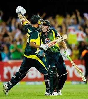James Faulkner and Clint McKay celebrate after Australia beat England in the second ODI.