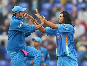 Suresh Raina and Ishant Sharma celebrate a dismissal