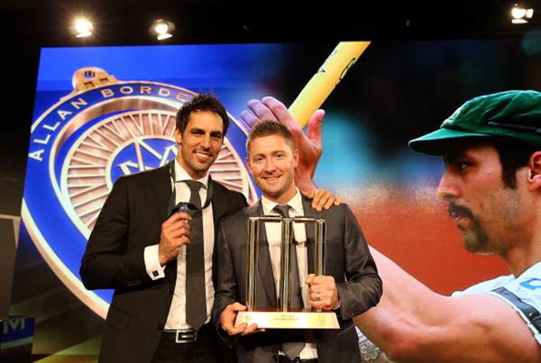 Mitchell Johnson poses with Michael Clarke after winning the Allan Border Medal during the 2014 Allan Border Medal at Doltone House in Sydney on Monday