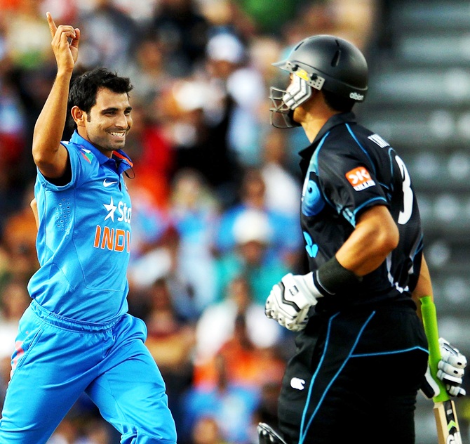 Mohammed Shami of India celebrates after taking the wicket of Ross Taylor