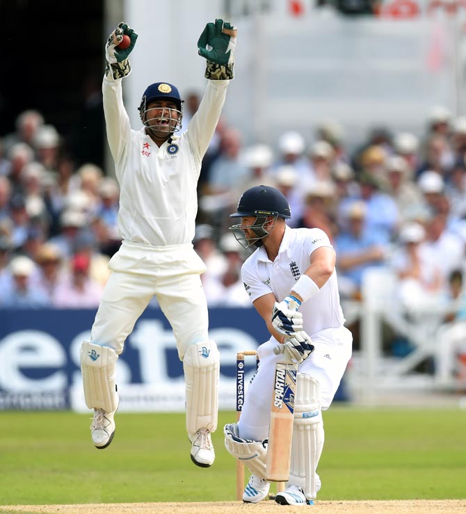 India captain Mahendra Singh Dhoni appeals successfully for the wicket of England batsman Matt Prior off the bowling of Bhuvneshwar Kumar