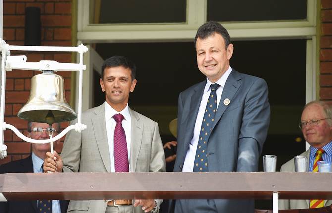 Former India batsman Rahul Dravid, watched by Derek Brewer of the MCC, prepares to ring the 'five-minute bell', before Day 1 of the second Investec Test between England and India at Lord's on Thursday.