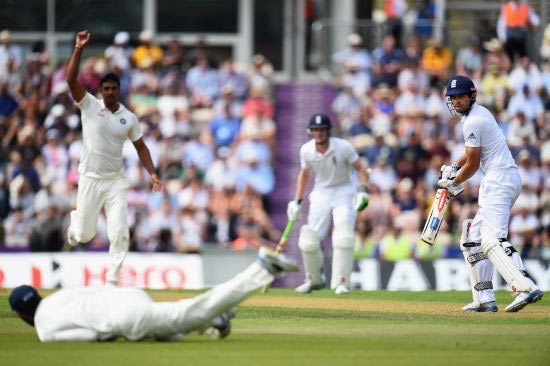 Captain Alastair Cook of England looks back as he tips the ball towards Ravindra Jadeja of India who drops the catch