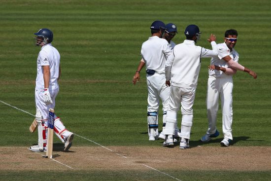 Gary Ballance of England is dismissed caught by wicketkeeper MS Dhoni off the bowling of Rohit Sharma, right, of India