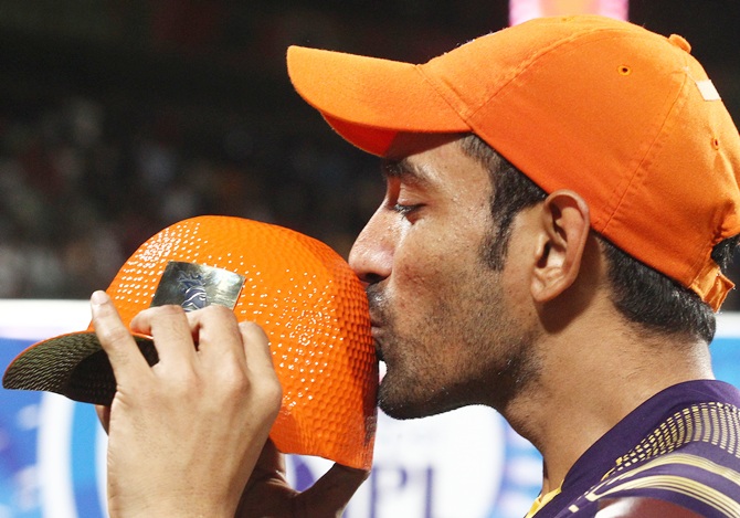 Robin Uthappa with the Orange cap, awarded to the highest scorer in the IPL