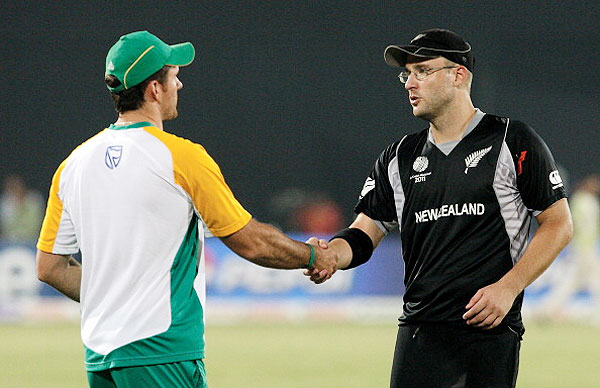 Graeme Smith of South Africa (left) shakes hands with Daniel Vettori of New Zealand after their 2011 ICC World Cup quarter-final at Shere-e-Bangla National Stadium on March 25, 2011 in Dhaka