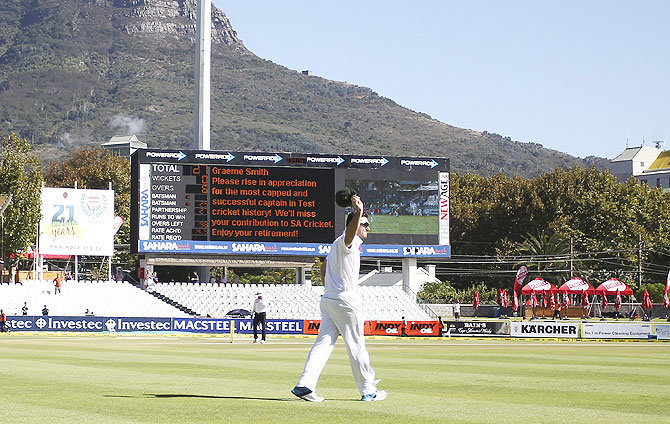 South Africa's captain Graeme Smith acknowledges the spectators after announcing his retirement during the fourth day of the third Test against Australia at Newlands Stadium in Cape Town on Monday